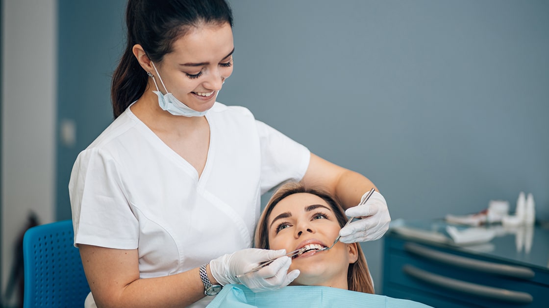 dental assistant and patient